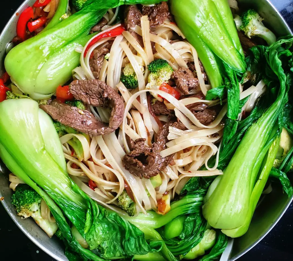 bok chok, flank steak, broccoli, red pepper in an asian style savory sauce