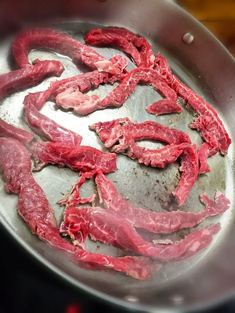 saute thinly sliced flank steak