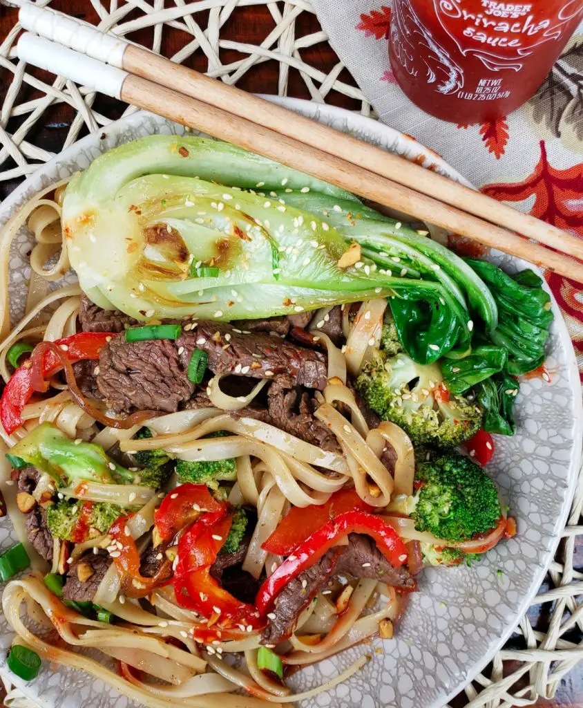 steak, bok choy, broccoli, red bell pepper and gluten free noodles with sriracha
