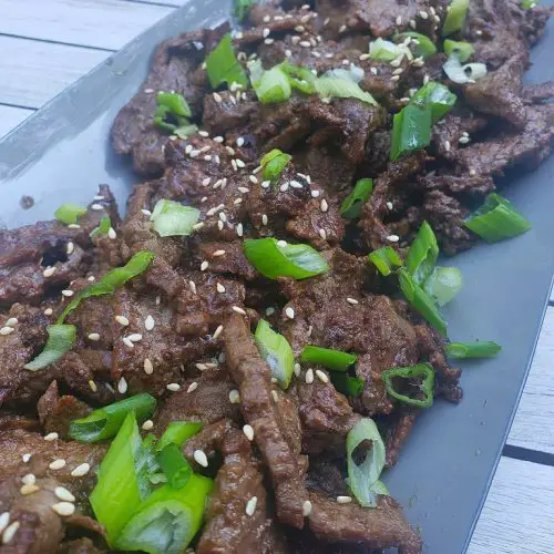 Korean Beef Bulgogi with scallions and sesame seeds