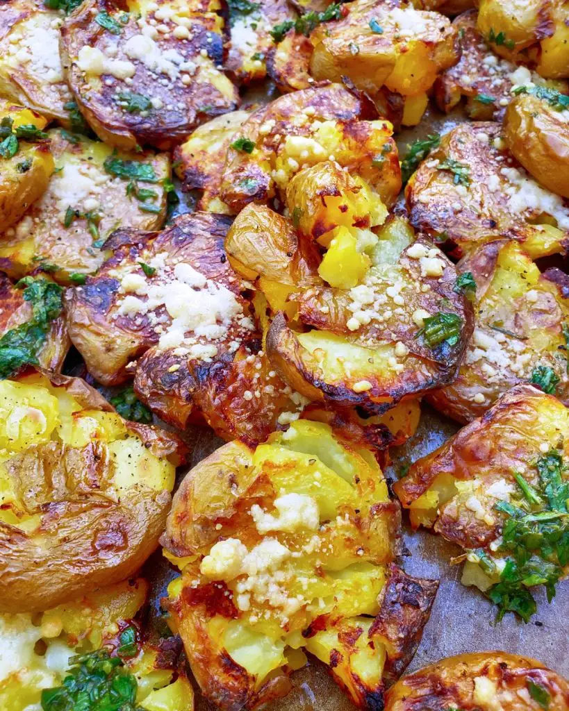 smashed roasted crispy baby potatoes with fresh herbs and parmesan cheese