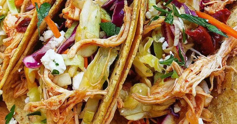 Chipotle Orange Chicken Tacos with Mango-Lime Slaw