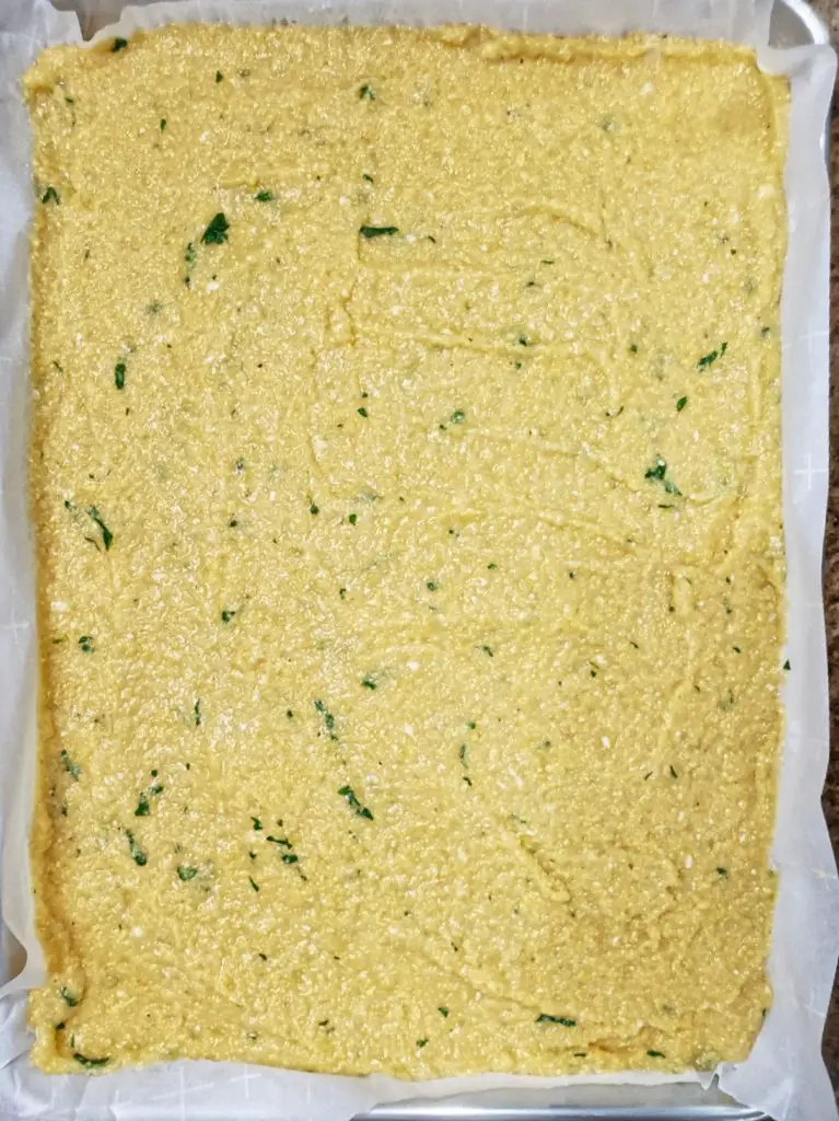 polenta spread on baking dish