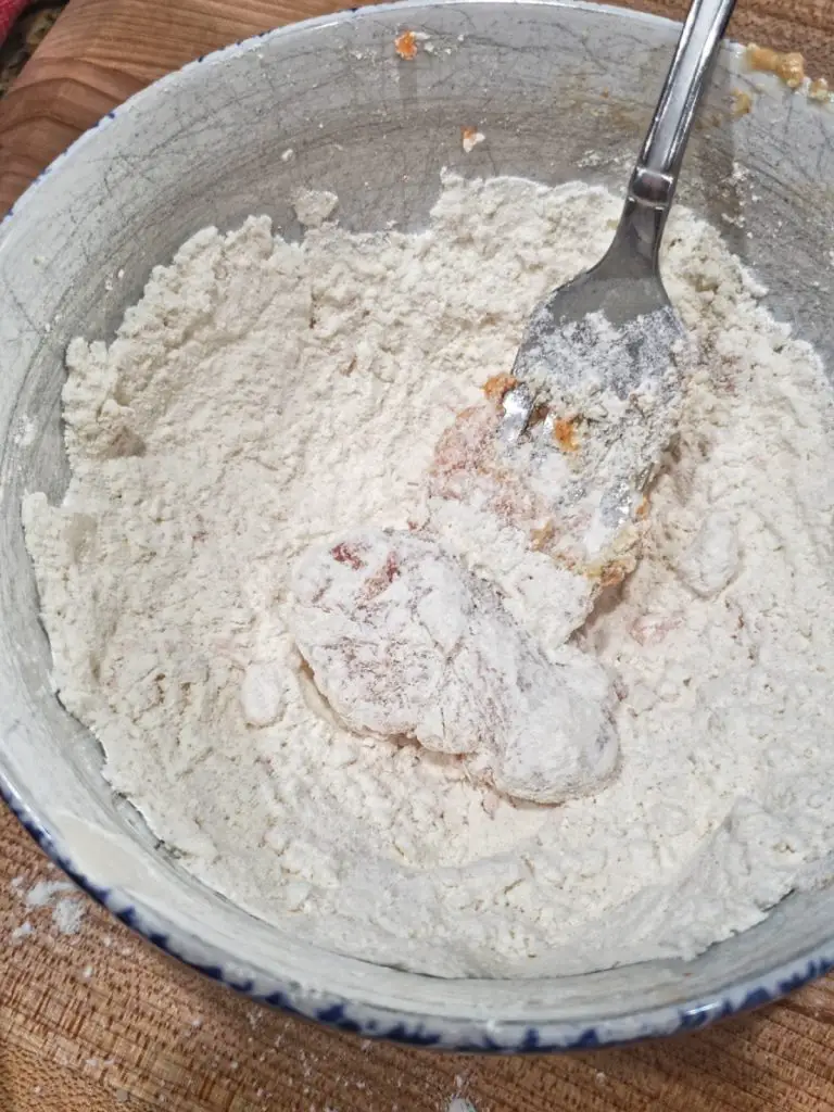 dredge chicken in flour