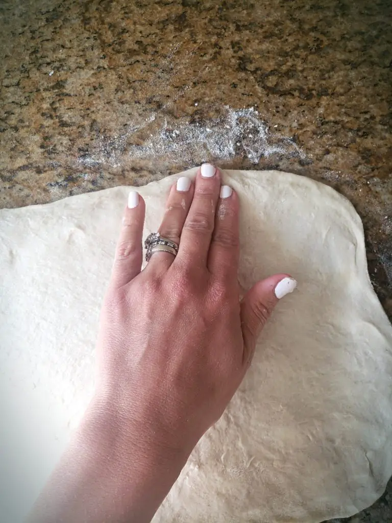 use hands on edges to press dough into shape