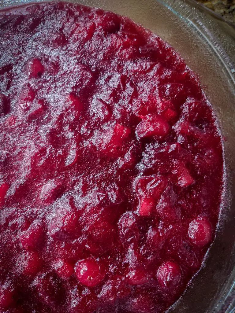 remove CRANBERRY SAUCE WITH APPLES AND ORANGE ZEST and let cool