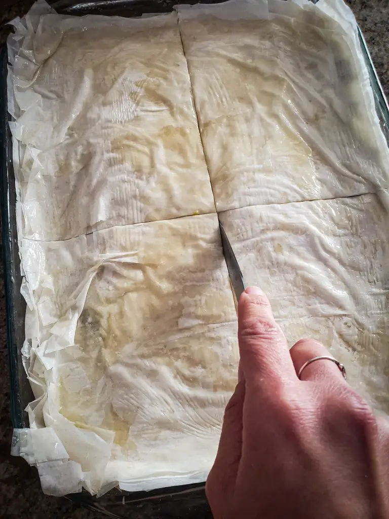 score top phyllo layer of spanakopita