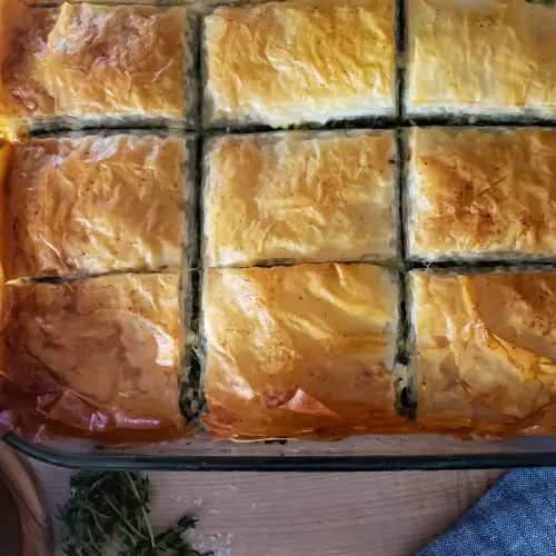 overhead close up of baked greek spanakopita spinach pie