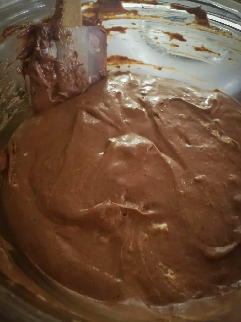gently fold in egg whites and whipped cream to make dark chocolate mousse