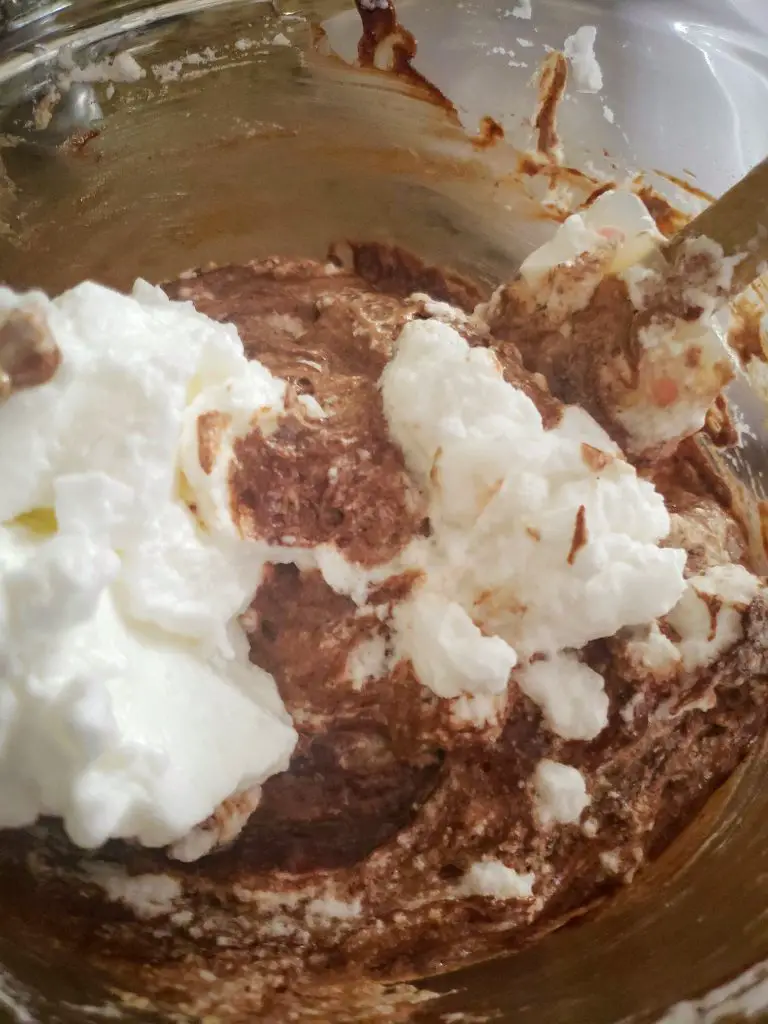fold in egg whites to melted chocolate to make dark chocolate mousse