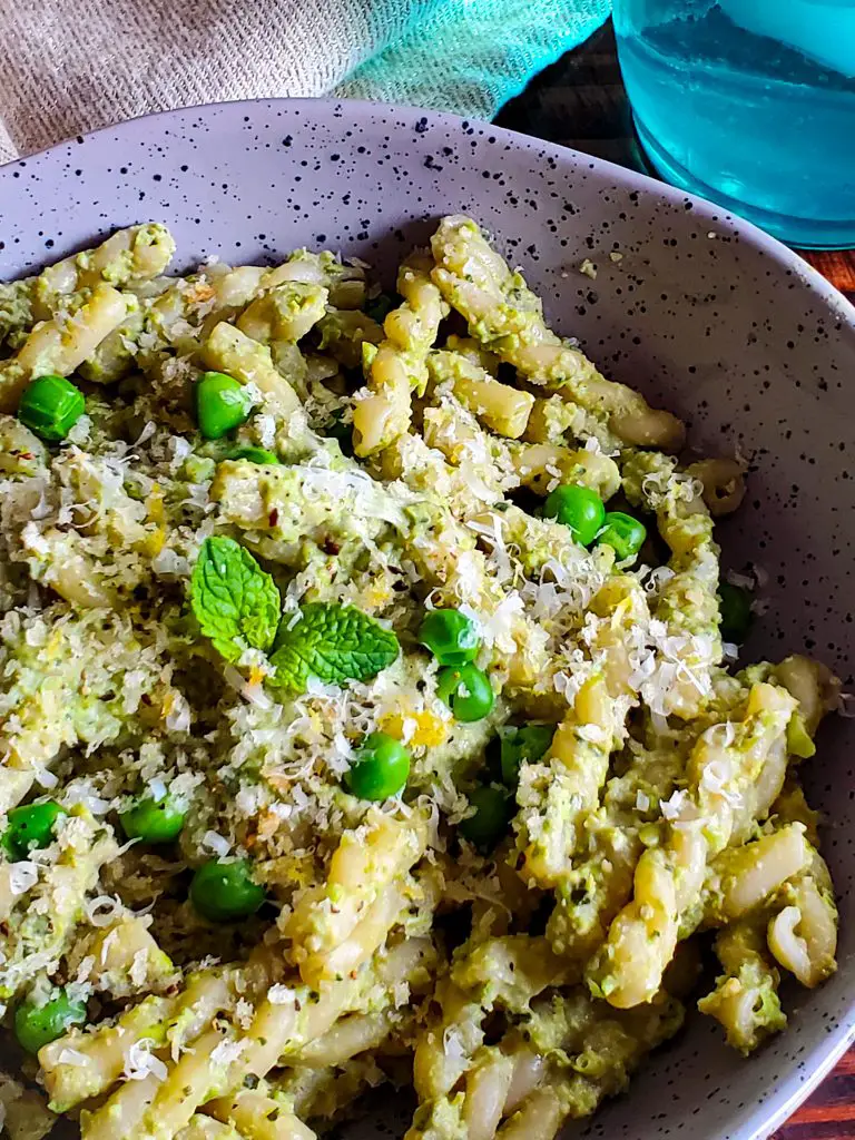 image of bowl of pasta with pea and mint pesto with lemon panko breadcrumbs