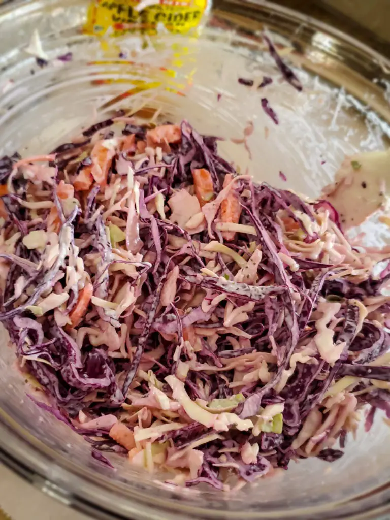 image of homemade coleslaw for pulled pork sandwiches in glass bowl