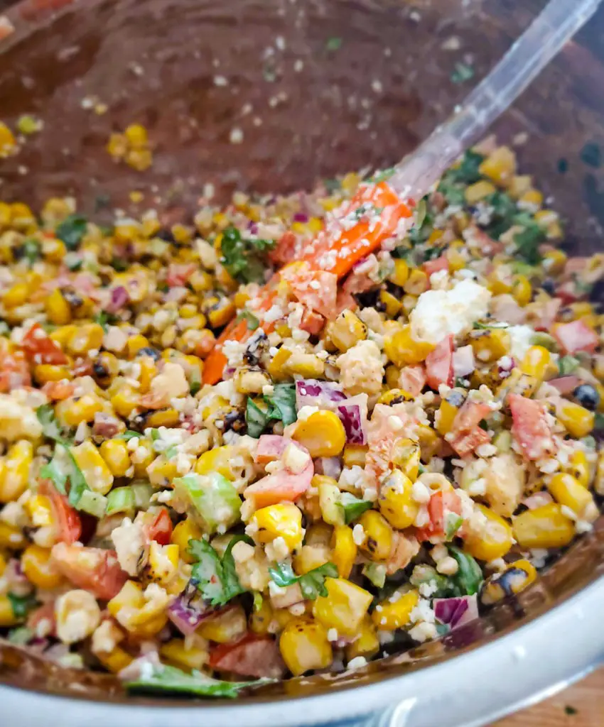 mexican street corn salad in mixing bowl
