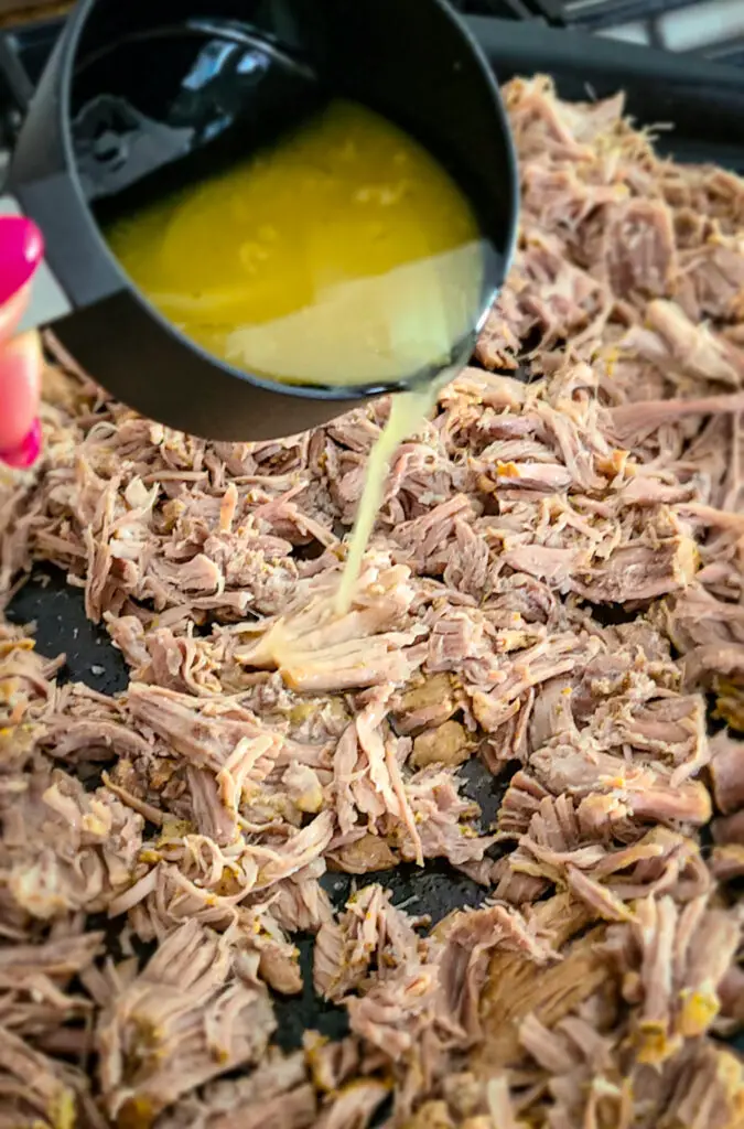 add cooking liquid to the shredded pork while broiling