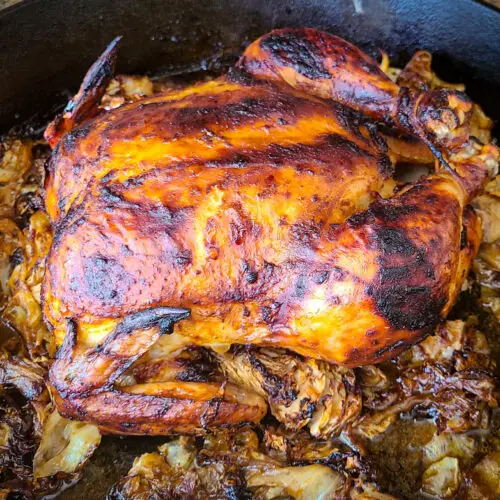 Slow-roasted gochujang chicken and caramelized cabbage in cast iron pan
